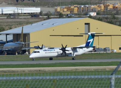 Image of aircraft registration C-FQWE - A DHC-8-402Q operated by WestJet Encore